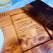 Close-up of hidden margarita recipe engraved under the removable walnut cutting board on a handcrafted wooden salt tray.